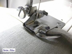 Pėdelė dvigubam medžiagos krašto palenkimui (apie 10 mm)